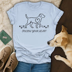 Light blue t-shirt with a dog outline, heart, paw prints, and "Follow Your Heart" text.