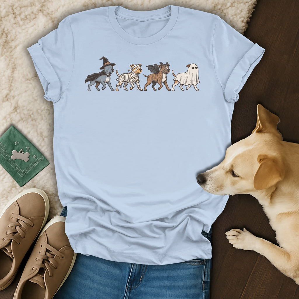 Light blue t-shirt with four dogs in Halloween costumes: witch, mummy, bat, and ghost.