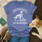 Blue t-shirt with graphic of a golden retriever on books, text about loyalty and rules.