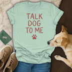 Light blue t-shirt with red text "TALK DOG TO ME" and paw print.