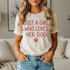 Cream t-shirt with "Just a girl who loves her dog" and paw print in red.