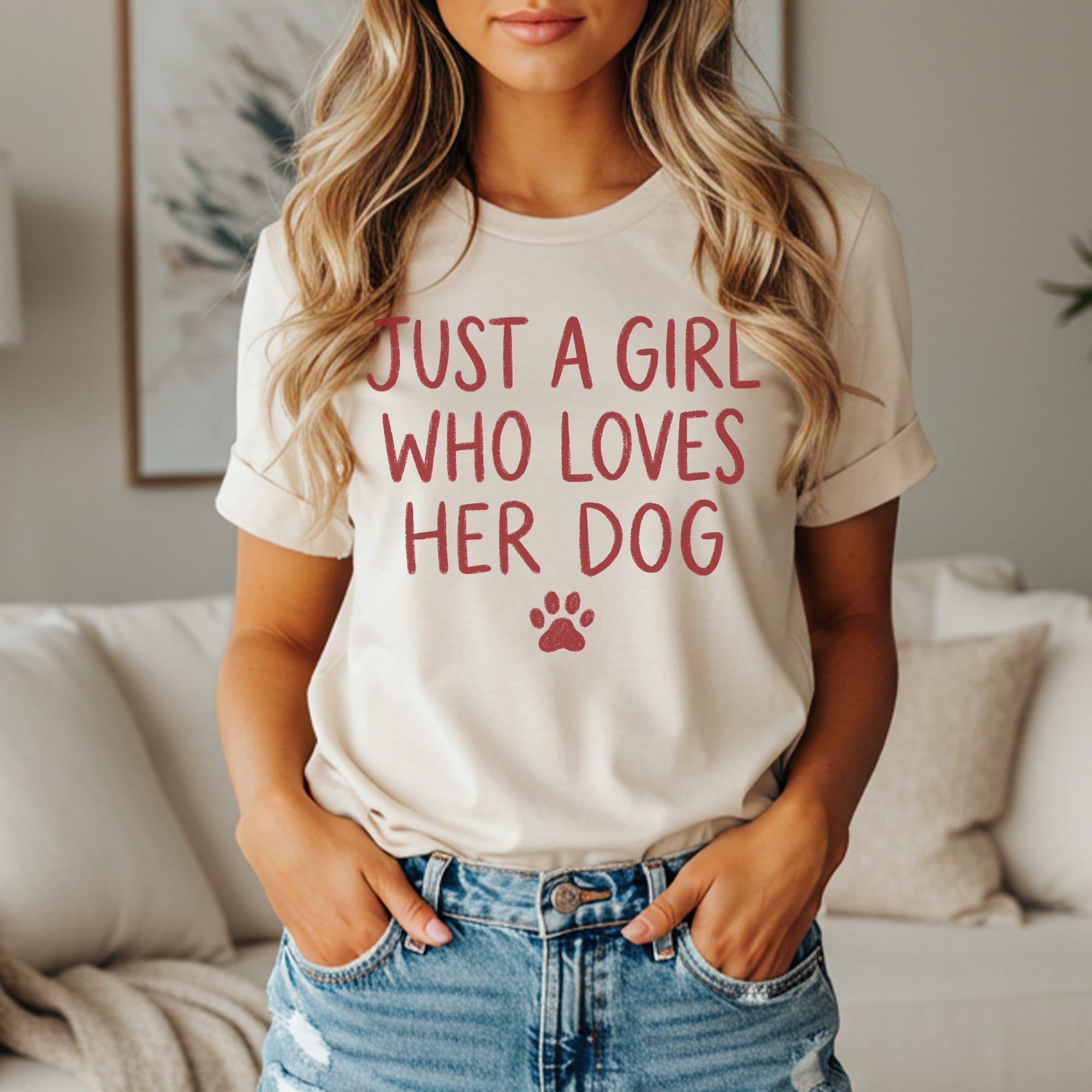 Cream t-shirt with "Just a girl who loves her dog" and paw print in red.