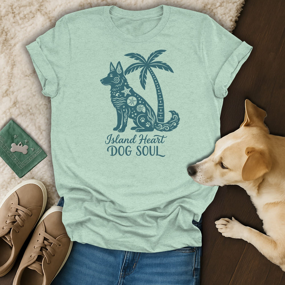 Light blue t-shirt with a dark blue graphic of a dog and palm tree.