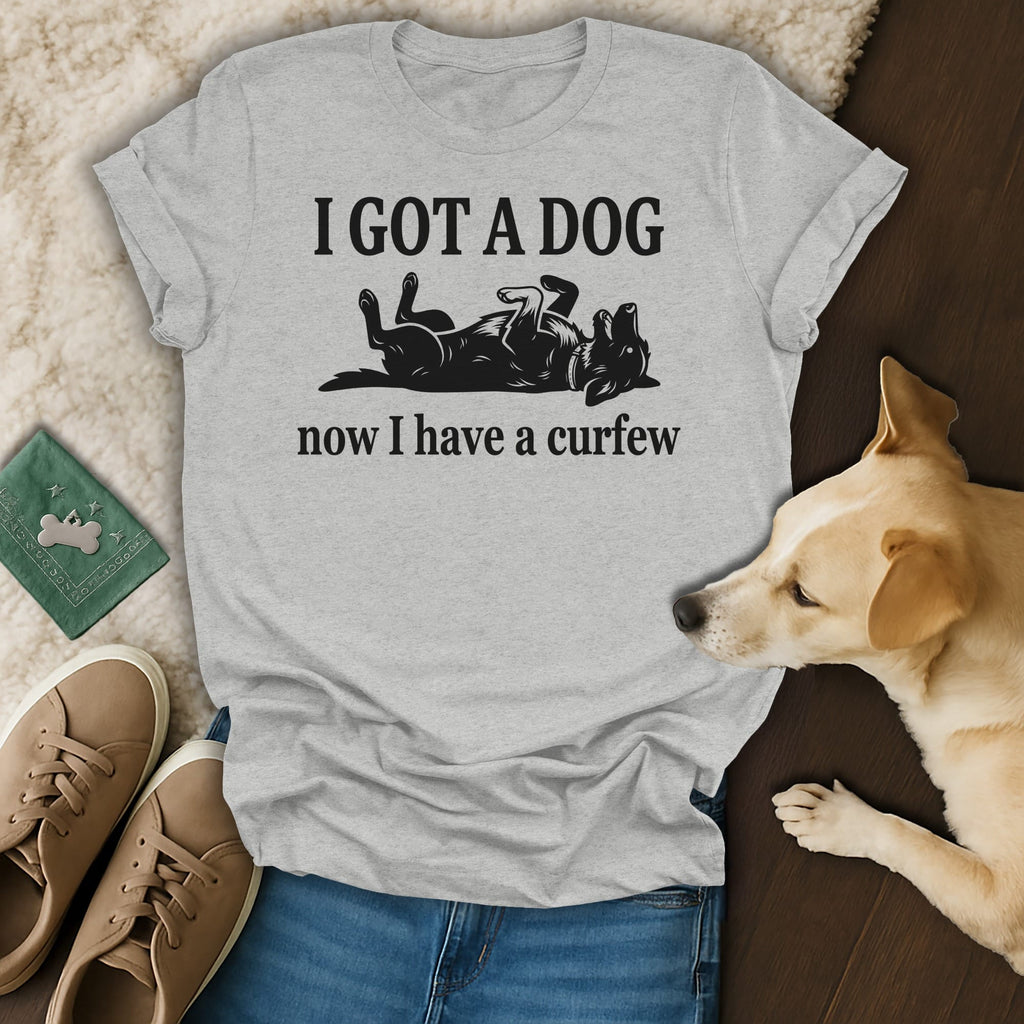 Light grey t-shirt with black text "I GOT A DOG now I have a curfew" and dog graphic.
