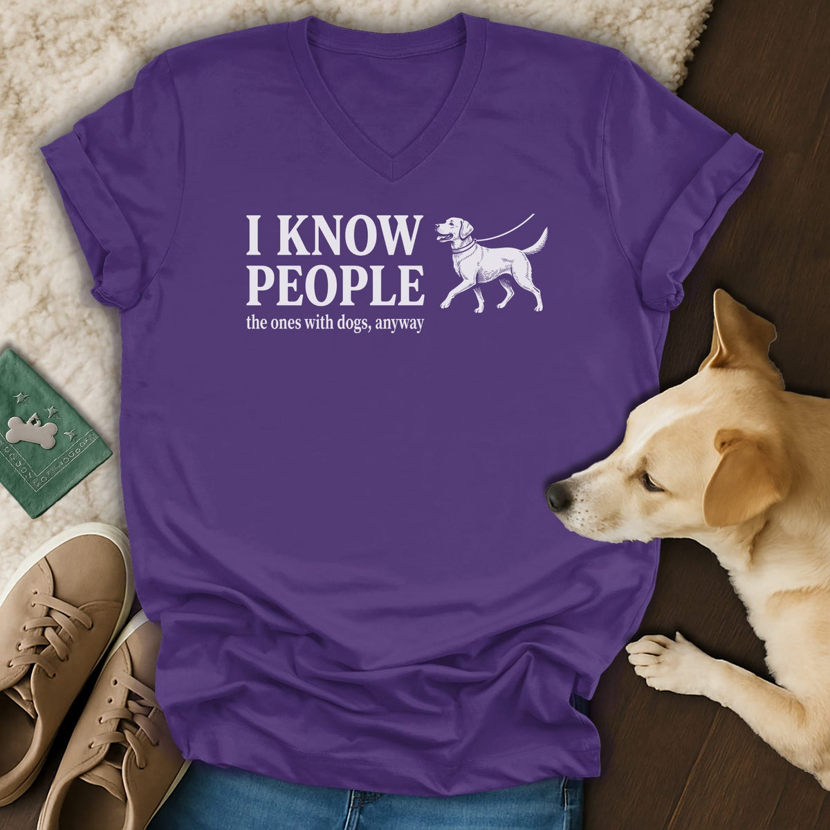 Purple v-neck t-shirt with "I KNOW PEOPLE the ones with dogs, anyway" text and dog graphic.