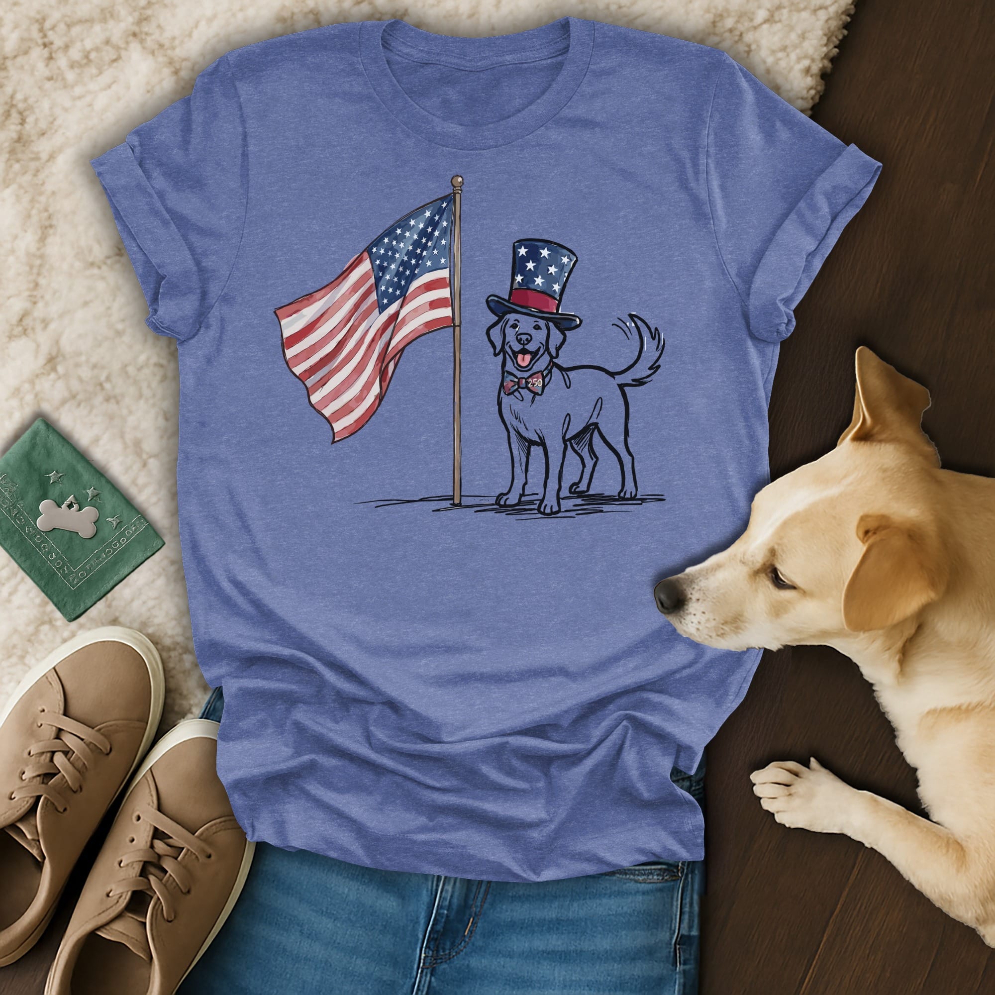 Dog in top hat salutes American flag on blue t-shirt.