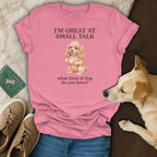 Pink t-shirt with a cocker spaniel holding a teacup and text reading "I'M GREAT AT SMALL TALK".