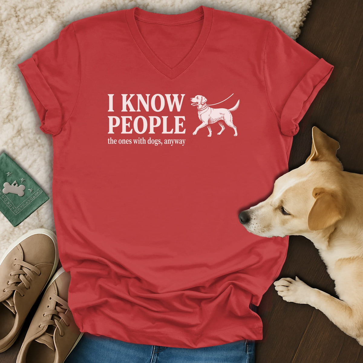Red v-neck t-shirt with "I know people the ones with dogs, anyway" and dog graphic.