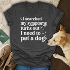 Dark gray v-neck t-shirt with white text "I searched my symptoms turns out I need to pet a dog."