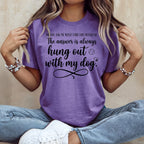 Purple t-shirt with black text: "The answer is always hung out with my dog."