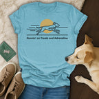Light blue t-shirt with dog running graphic and text "Runnin' on Treats and Adrenaline".