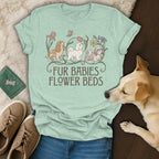 A light green t-shirt with a graphic of three dogs and the text FUR BABIES FLOWER BEDS.