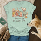 Light blue t-shirt with cartoon dogs and text "HAP-PUP-LY EVER AUTUMN"