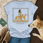 Light blue t-shirt with Egyptian-inspired graphic and text.