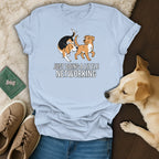 Light blue t-shirt with a graphic of two dogs and the text "JUST DOING A LITTLE NETWORKING".