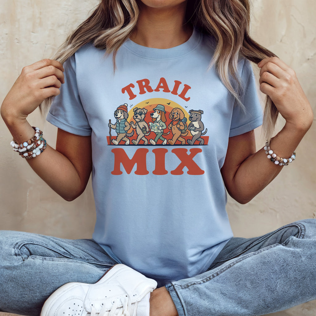 Light blue t-shirt with cartoon dogs hiking and text "TRAIL MIX".