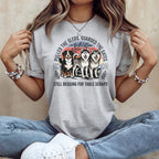 Three huskies on a t-shirt with text "Pulled the sleds. Guarded the gates, still begging for table scraps."