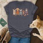 T-shirt with cartoon dogs wearing sweaters, scarves, and pumpkins.
