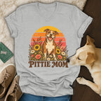 Gray v-neck t-shirt featuring a retro graphic of a pit bull surrounded by flowers with the text Pittie Mom.