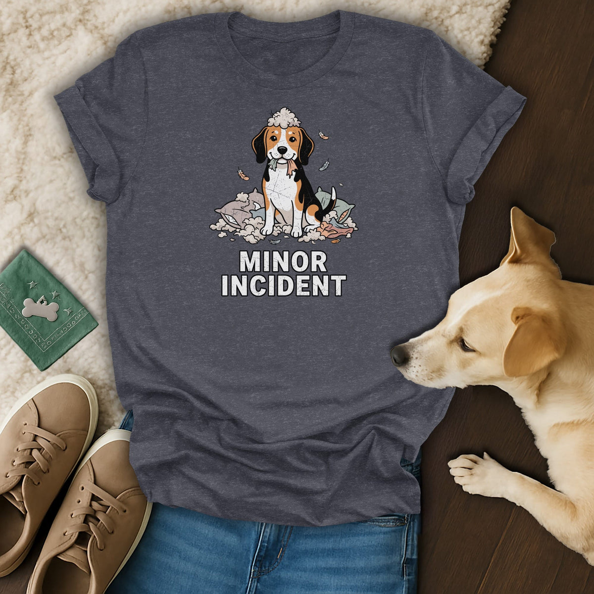 T-shirt with a cartoon beagle dog sitting in a pile of feathers and pillows, text reads "MINOR INCIDENT".