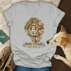 Heather gray v-neck t-shirt featuring a graphic of a puppy in a birdhouse with flowers and the text Home is where the dog is.