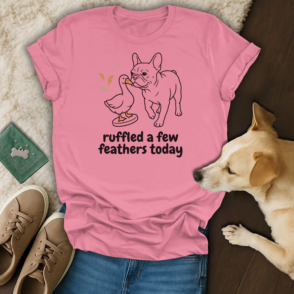 Pink t-shirt with a French bulldog and duck illustration and text "ruffled a few feathers today".
