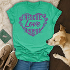 Teal t-shirt with "RESCUE. LOVE. Repeat." and paw prints in a heart.