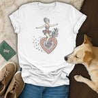 White t-shirt with graphic of woman on bicycle with dog, surrounded by stars and hearts.