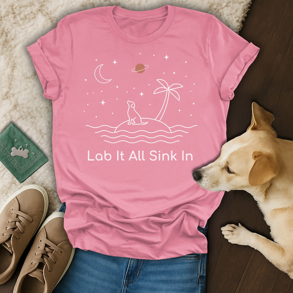 Pink t-shirt with a dog on an island under stars and a palm tree.