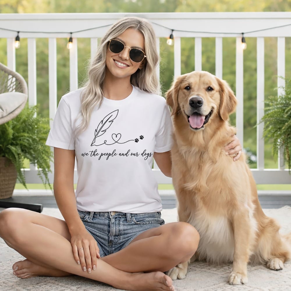 Woman wearing a white t-shirt with feather, paw prints, and text.