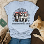 T-shirt with huskies and text "Pulled the sleds. Guarded the gates. Still begging for table scraps."