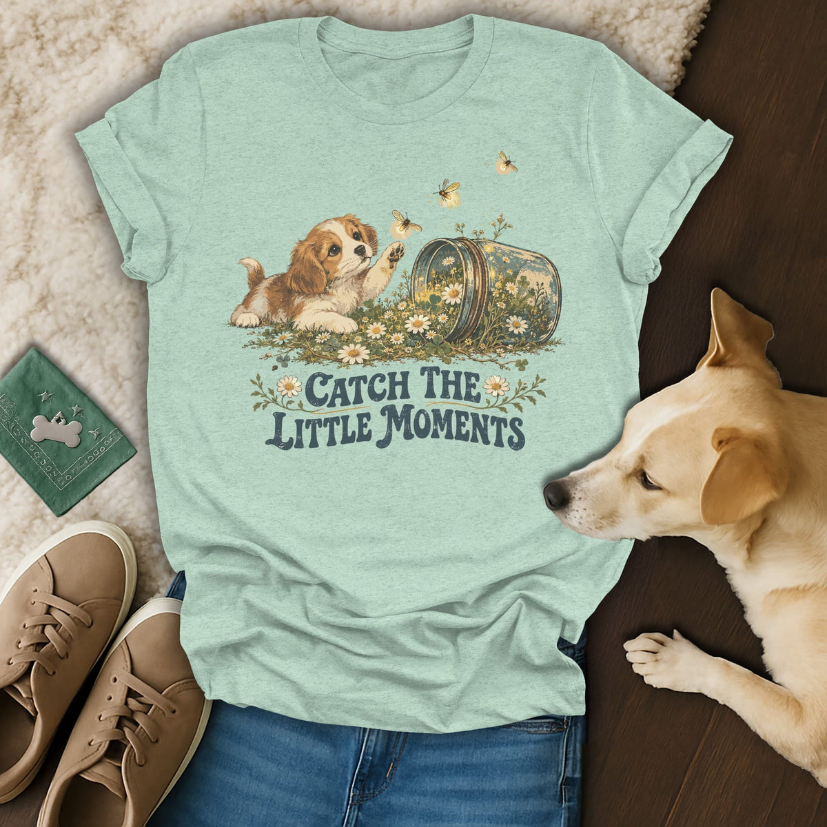 Sage green t-shirt featuring a puppy reaching for bees, with the text Catch the Little Moments.