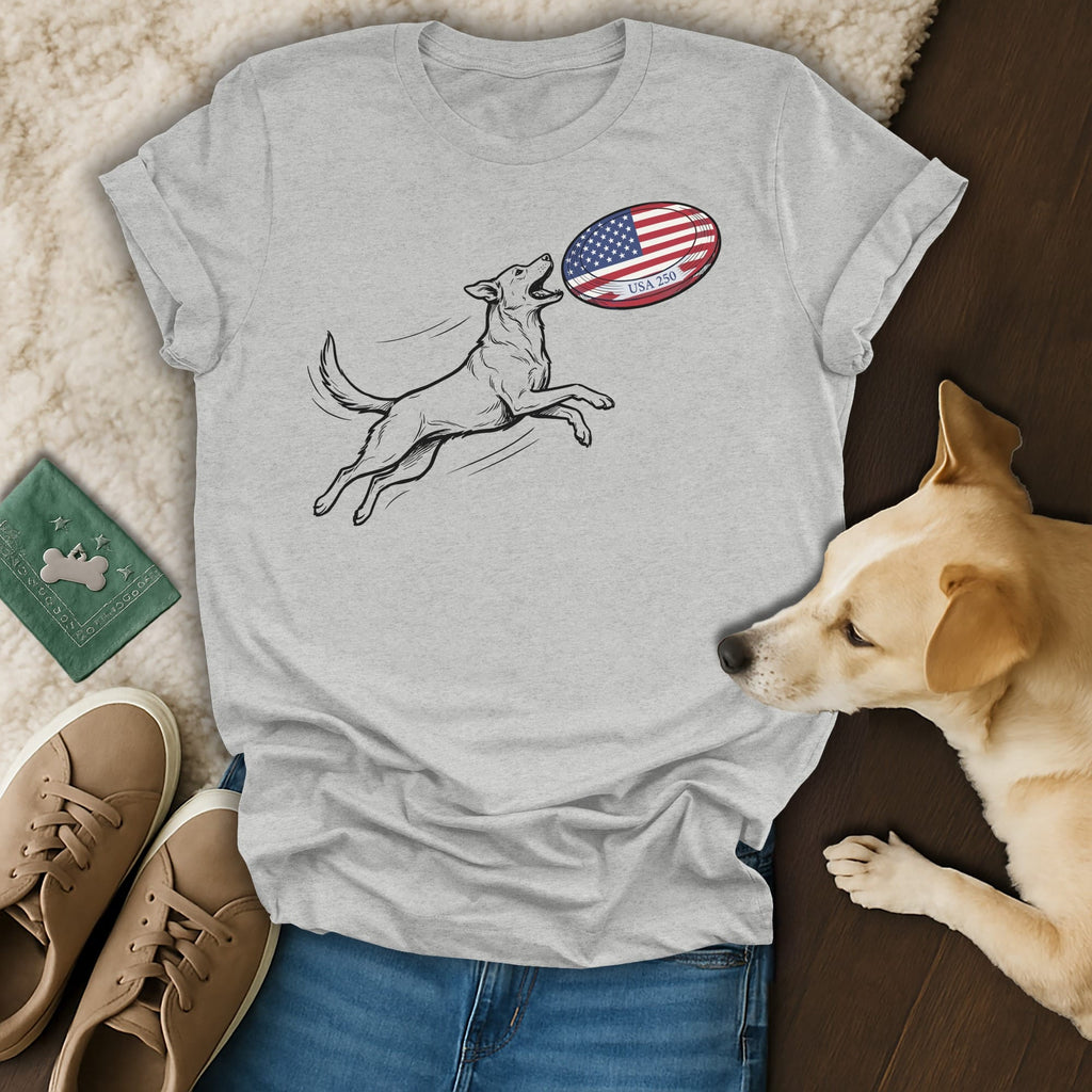 Gray t-shirt with dog catching an American flag rugby ball.