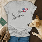 Gray t-shirt with dog catching an American flag rugby ball.
