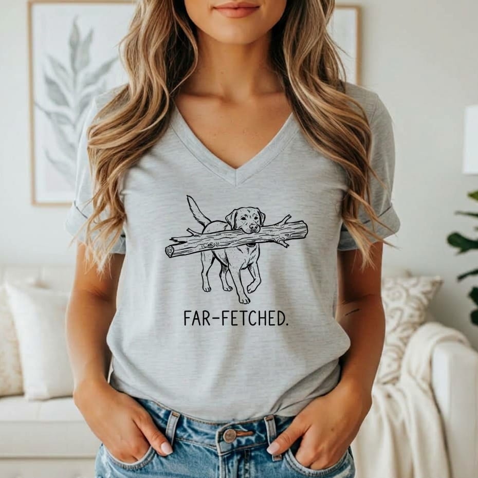 Grey t-shirt with line art of a dog carrying a log and the text "FAR-FETCHED."