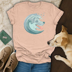 Peach t-shirt with a light blue wave dog graphic and paw prints.