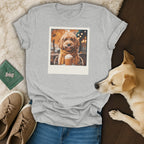 Grey t-shirt with a printed polaroid of a dog wearing glasses and a scarf with a drink.