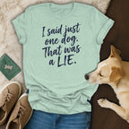 Light green t-shirt with navy text that reads "I said just one dog. That was a LIE."