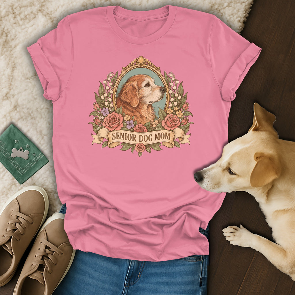 Pink t-shirt with a vintage-style graphic of a golden retriever in a floral frame and the text Senior Dog Mom.