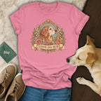Pink t-shirt with a vintage-style graphic of a golden retriever in a floral frame and the text Senior Dog Mom.