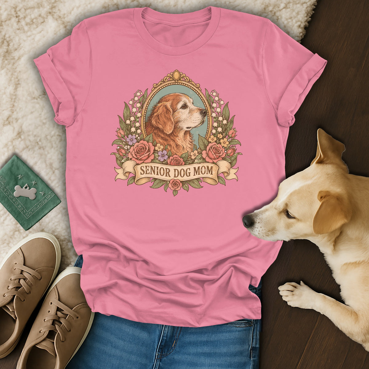Pink t-shirt with a vintage-style graphic of a golden retriever in a floral frame and the text Senior Dog Mom.