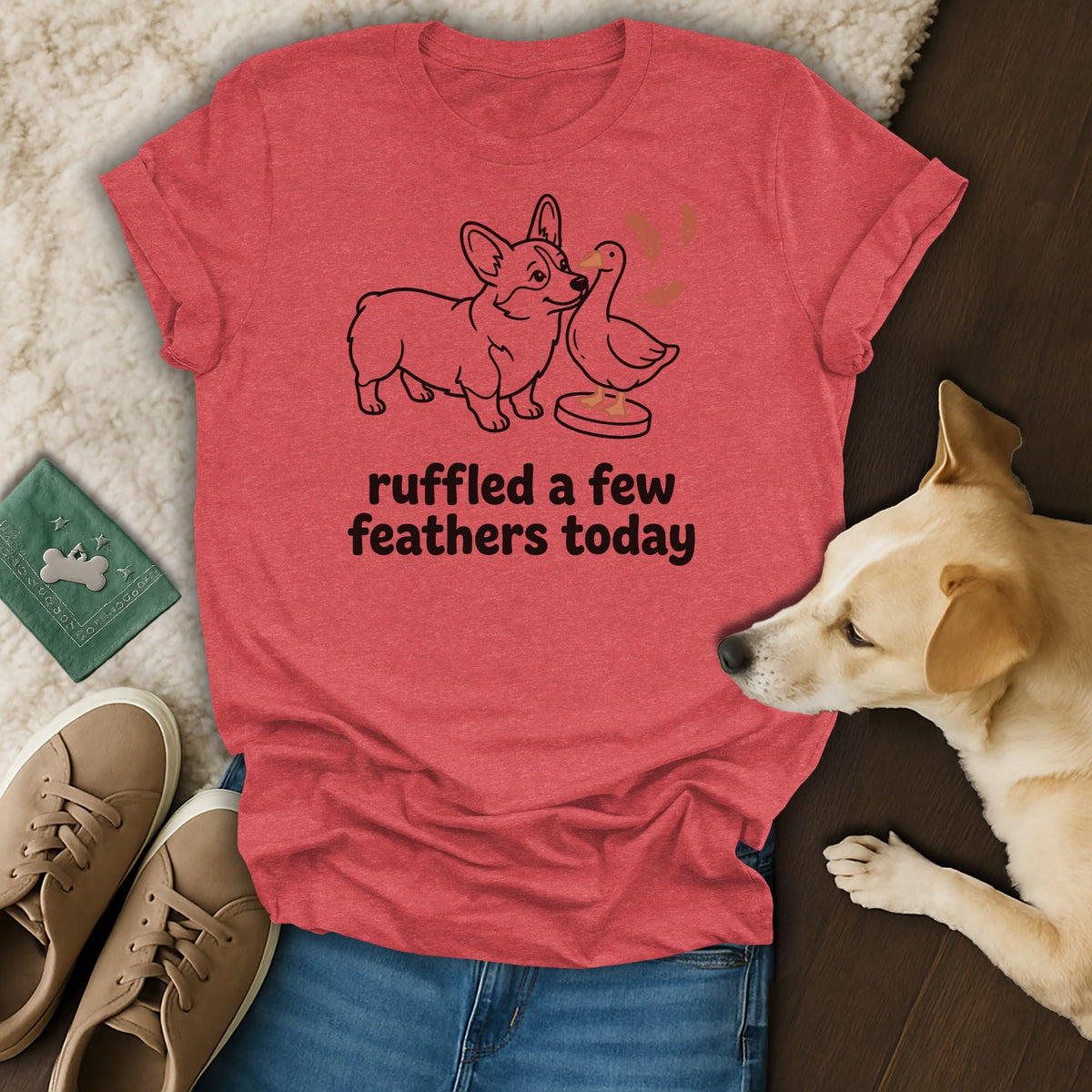 Coral t-shirt with a corgi and duck illustration and text "ruffled a few feathers today".