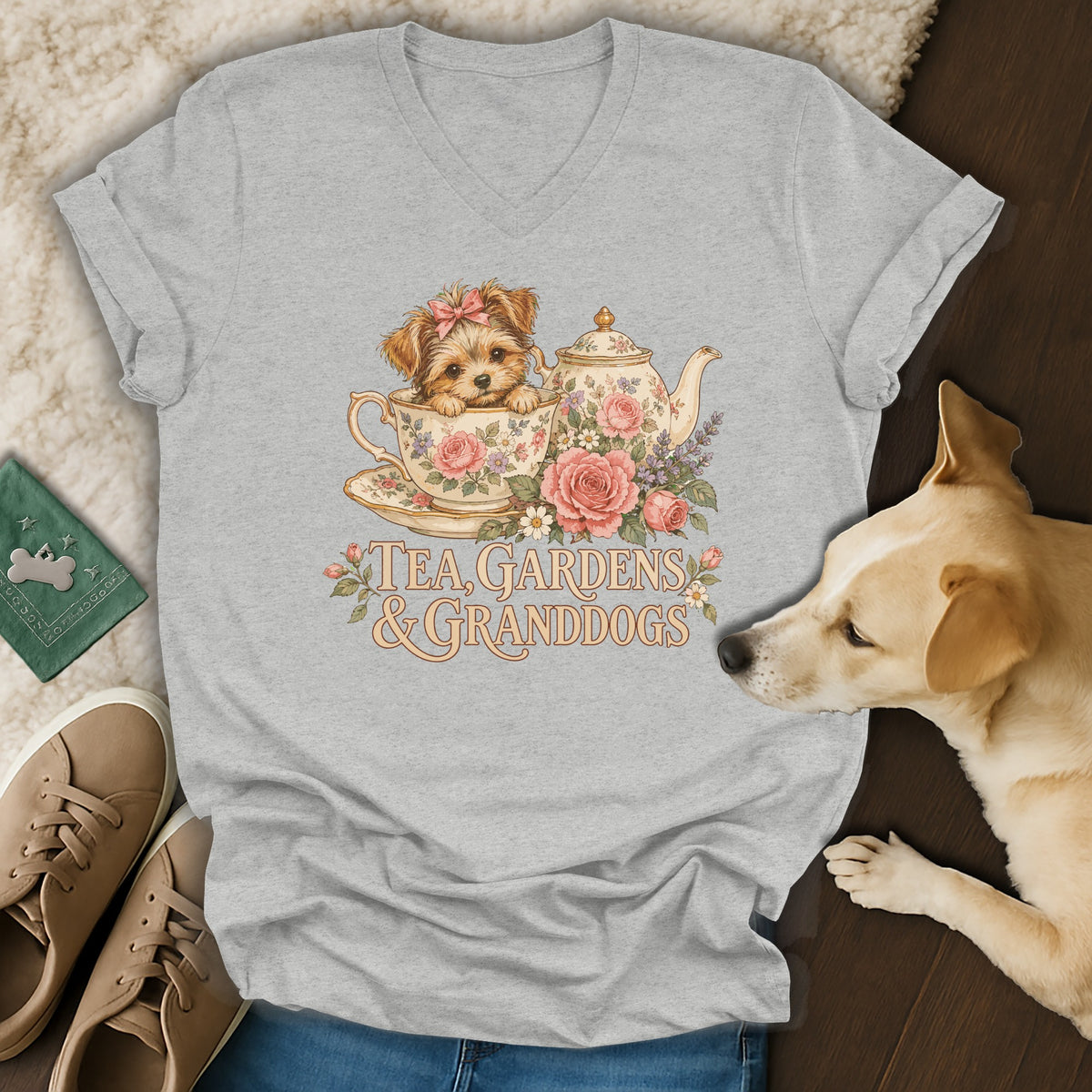 Heather gray V-neck t-shirt featuring a vintage graphic of a puppy in a teacup with flowers and text.