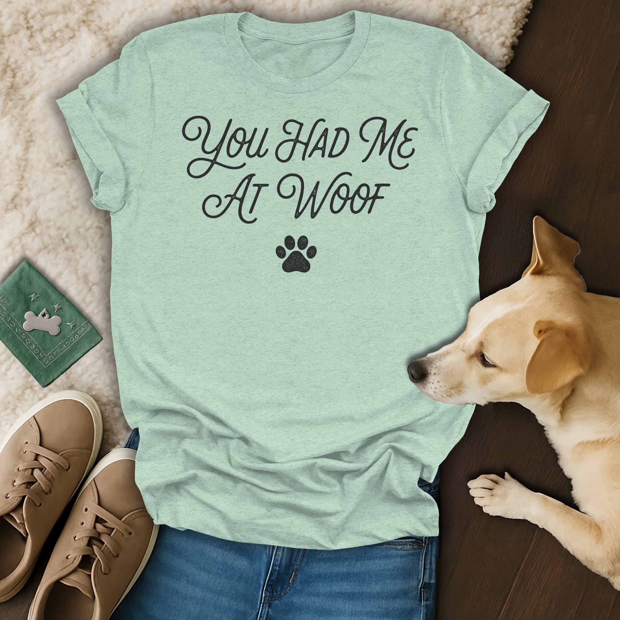 Light green t-shirt with "You Had Me At Woof" text and a paw print.