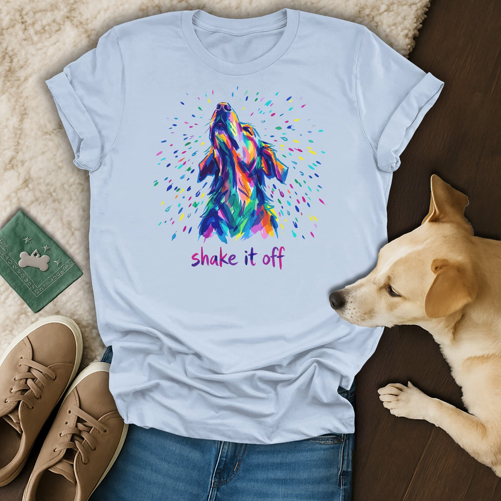 Colorful abstract dog head graphic with "shake it off" text on a light blue t-shirt.