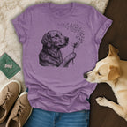 Golden retriever blowing dandelion seeds, depicted in a t-shirt design.