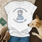 White t-shirt with a dog wearing a sweater and hat holding coffee.