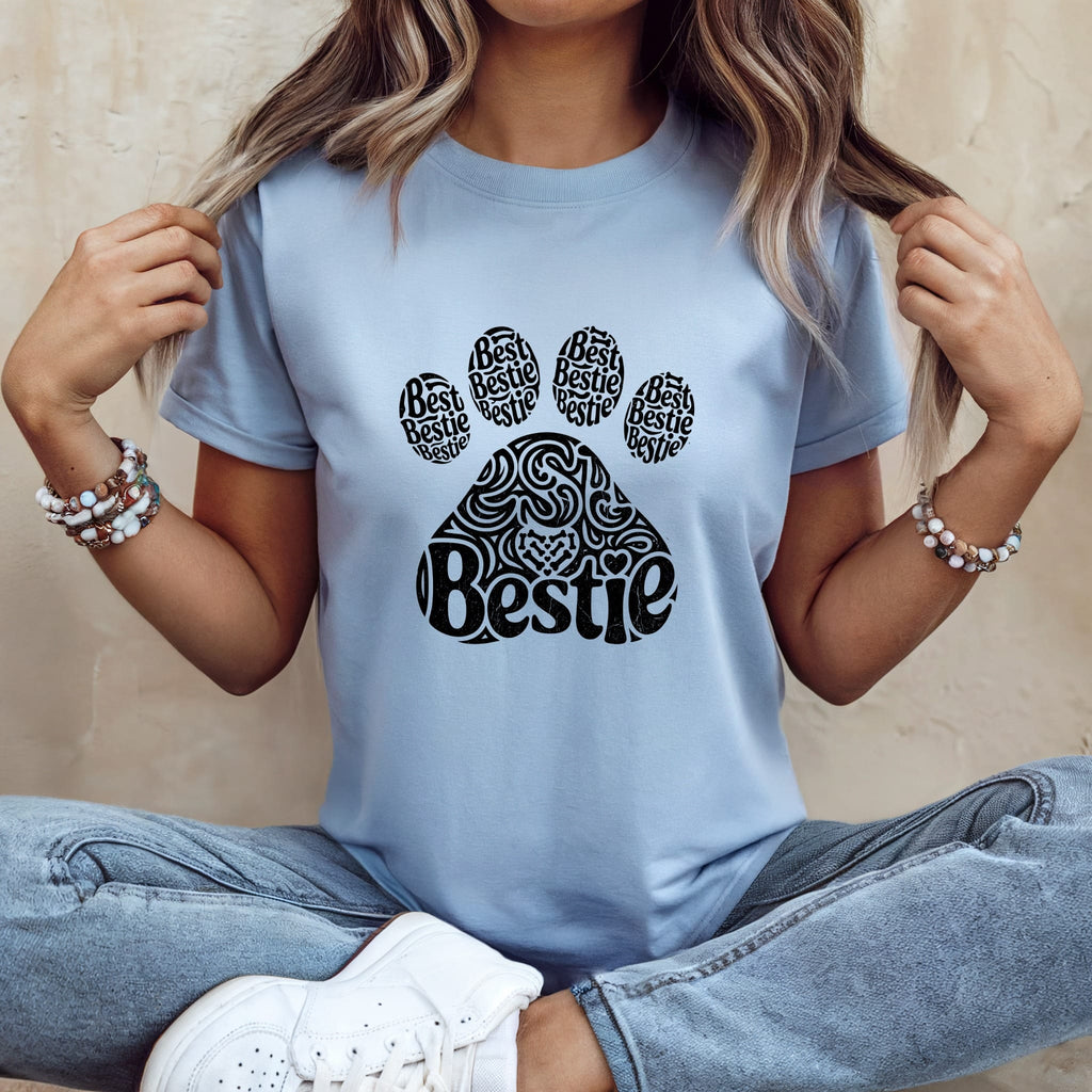 Light blue t-shirt with black paw print "Bestie" graphic.