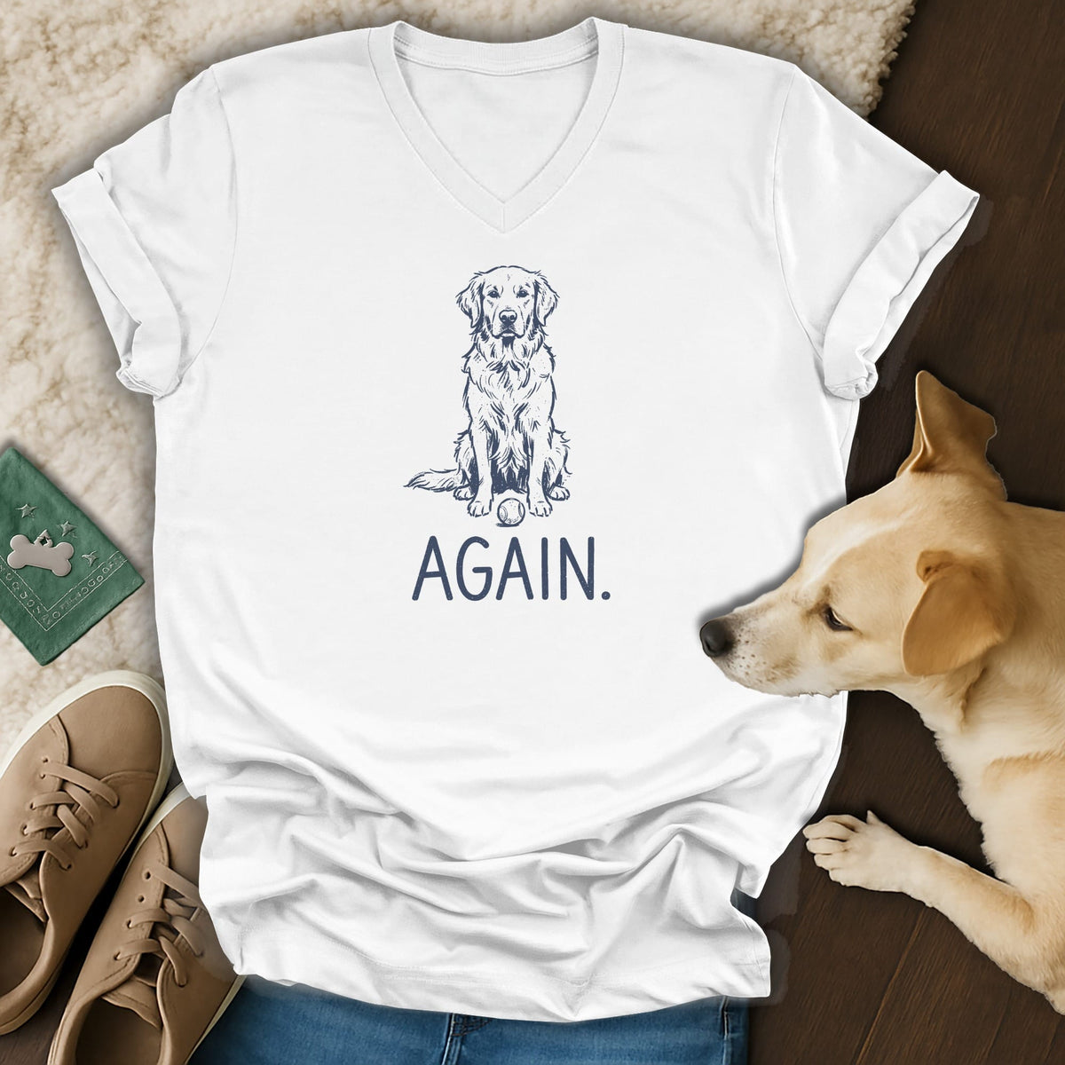 White v-neck t-shirt with a navy sketch of a Golden Retriever and the word "AGAIN."