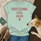 Mint t-shirt with red text "PROFESSIONAL DOG MOM" and a heart.